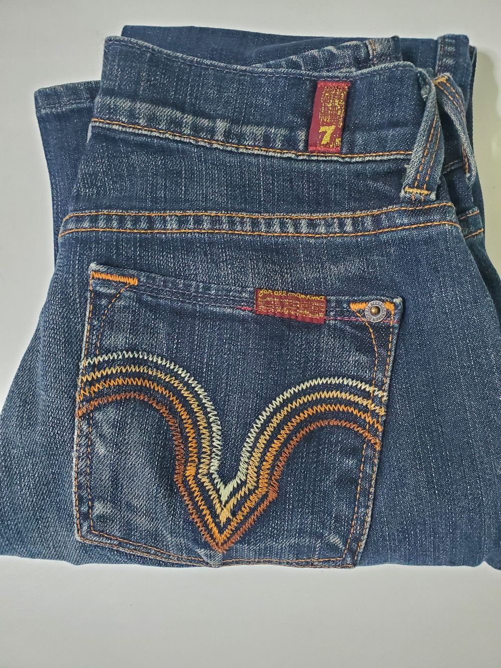 7 For All Mankind Dark Blue Bootcut Jeans with Multi-Color Pocket Stitching